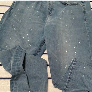 GAP jeans with a paint splatter design.